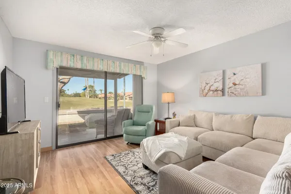a living room with furniture and a large window