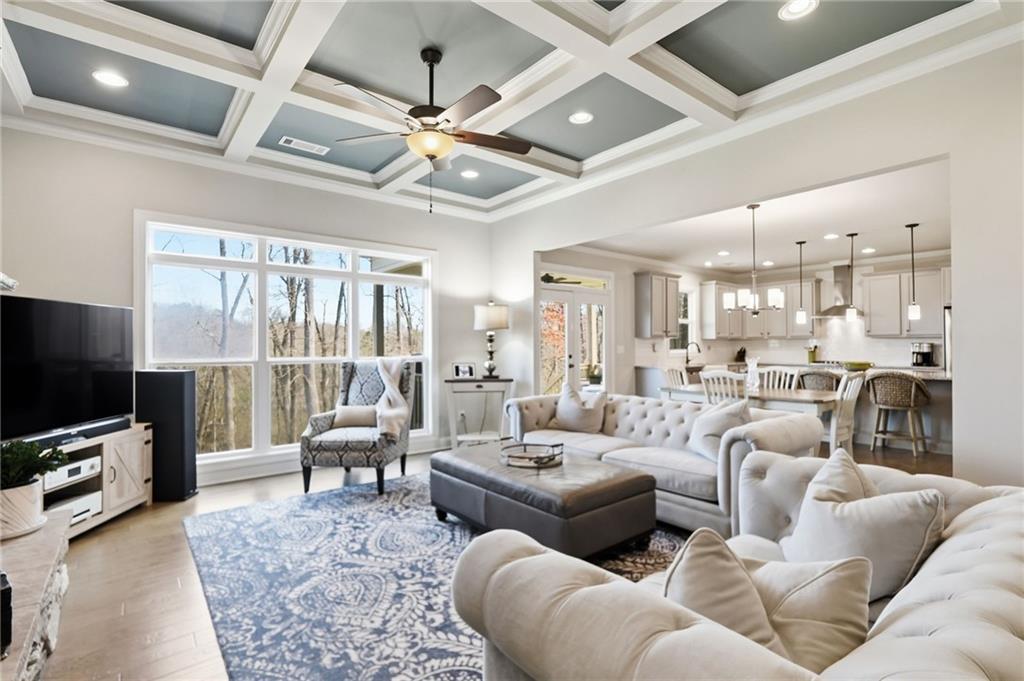 8840 Hightower Ridge Ball Ground, GA 30107 - Photo 13 of 74 a living room with furniture and a flat screen tv