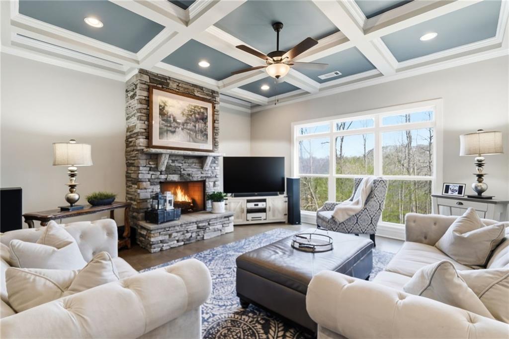 8840 Hightower Ridge Ball Ground, GA 30107 - Photo 14 of 74 a living room with furniture a large window and a flat screen tv