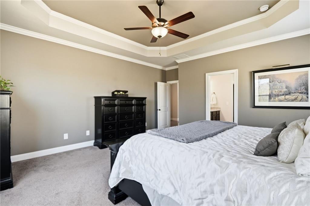 8840 Hightower Ridge Ball Ground, GA 30107 - Photo 24 of 74 a bedroom with a bed and a closet