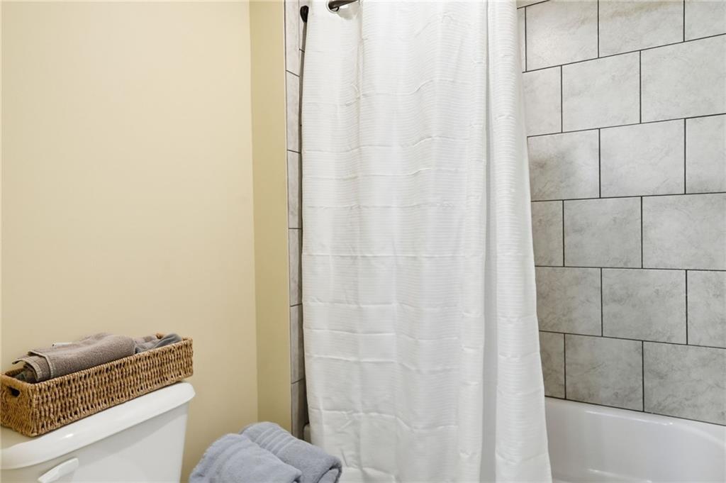 8840 Hightower Ridge Ball Ground, GA 30107 - Photo 38 of 74 a bathroom with a granite countertop bathtub and sink