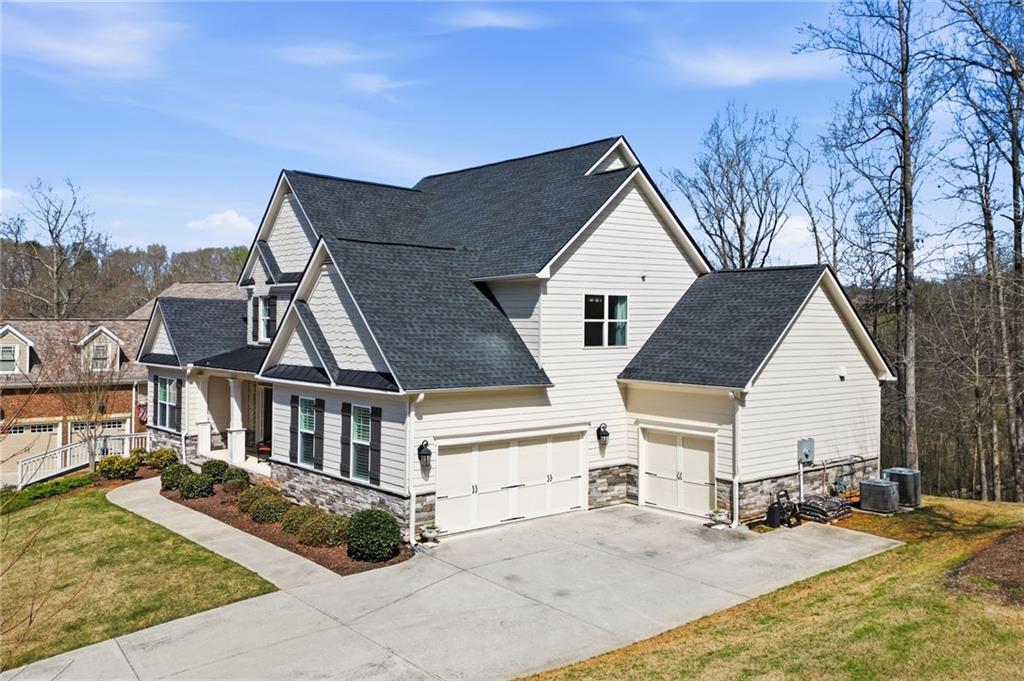 8840 Hightower Ridge Ball Ground, GA 30107 - Photo 4 of 74 front view of a house with a outdoor space