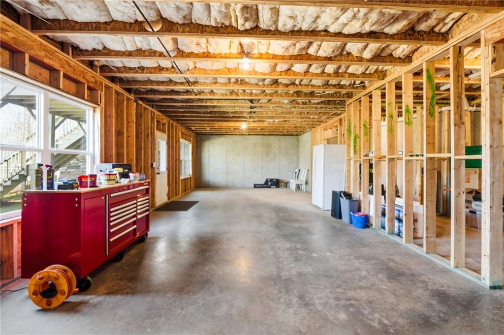 8840 Hightower Ridge Ball Ground, GA 30107 - Photo 43 of 74 a view of an entryway with a chandelier