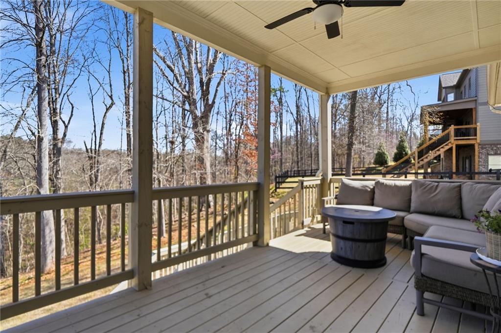 8840 Hightower Ridge Ball Ground, GA 30107 - Photo 46 of 74 a living room with furniture and a wooden floor