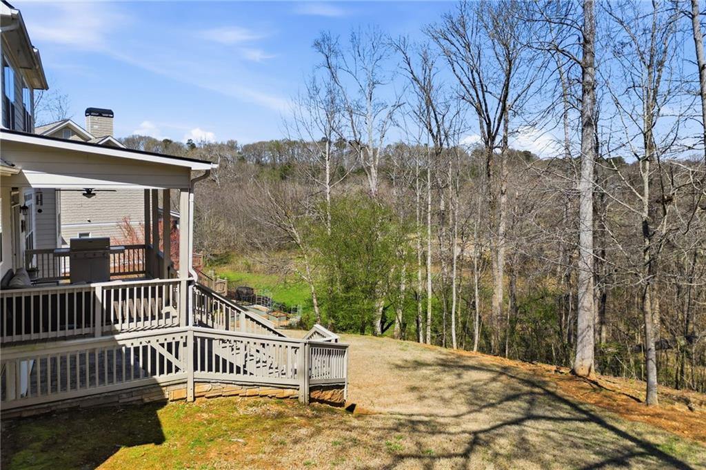 8840 Hightower Ridge Ball Ground, GA 30107 - Photo 48 of 74 a view of a roof deck with wooden fence and floor