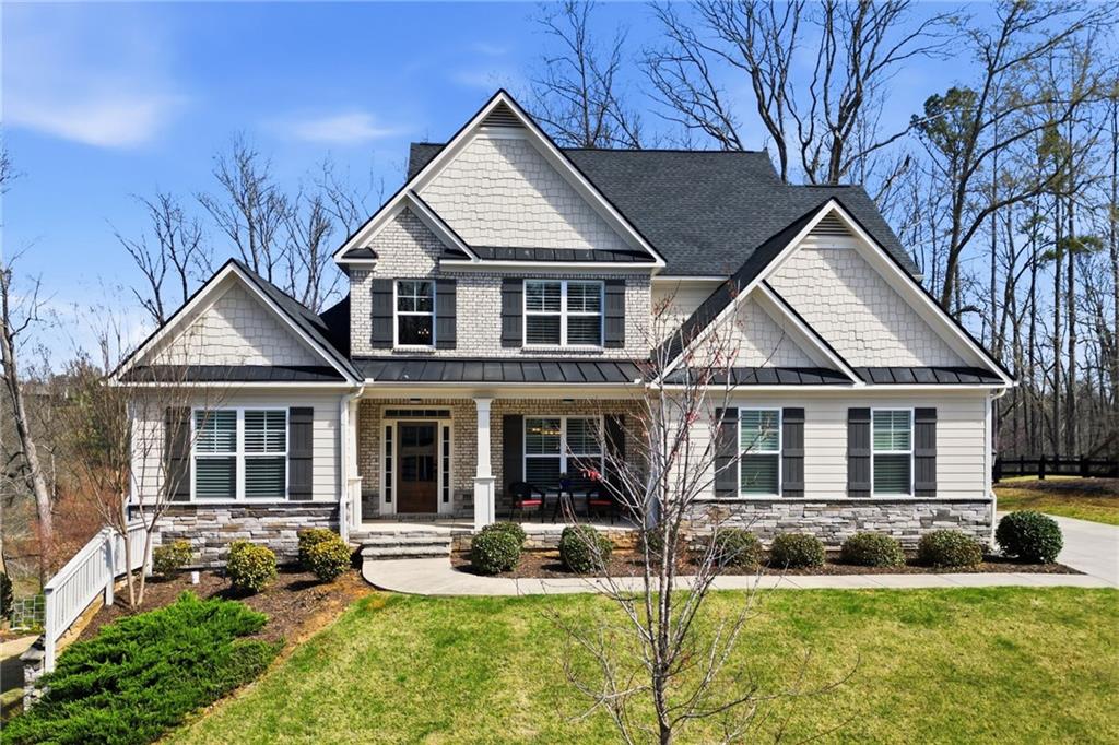8840 Hightower Ridge Ball Ground, GA 30107 - Photo 5 of 74 front view of a house with a yard