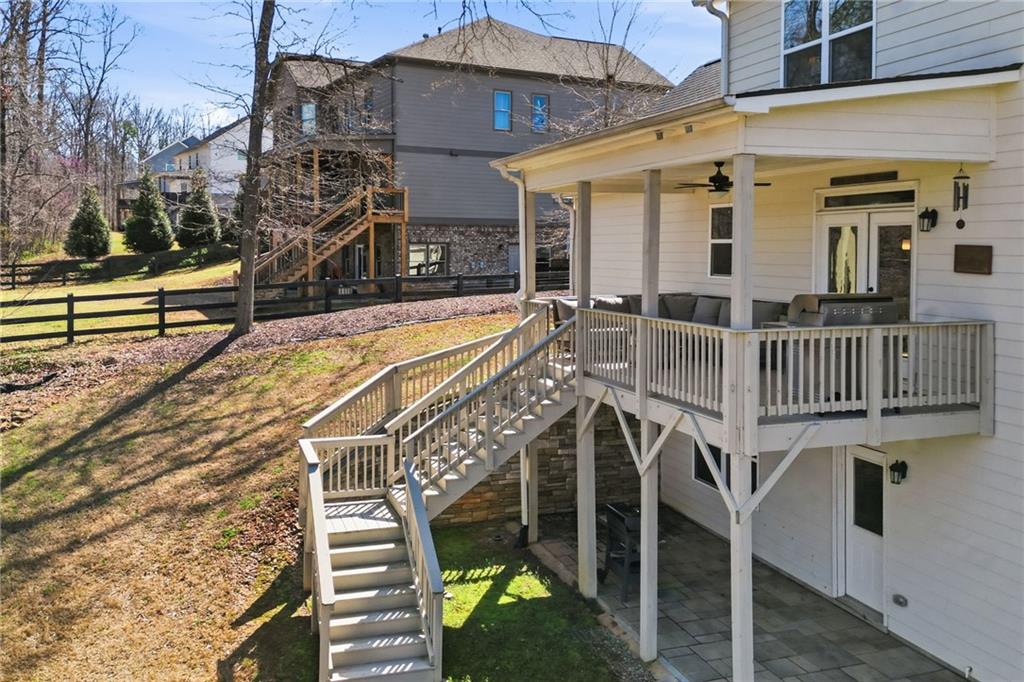 8840 Hightower Ridge Ball Ground, GA 30107 - Photo 52 of 74 a view of a house with backyard and deck