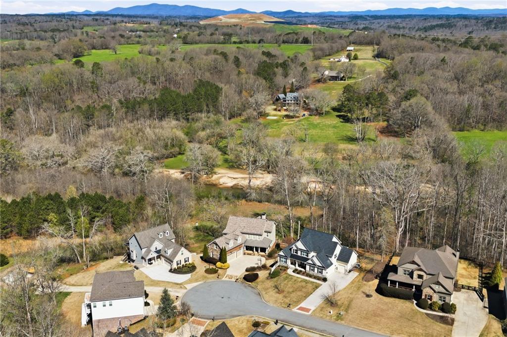 8840 Hightower Ridge Ball Ground, GA 30107 - Photo 54 of 74 an aerial view of a house with a mountain view