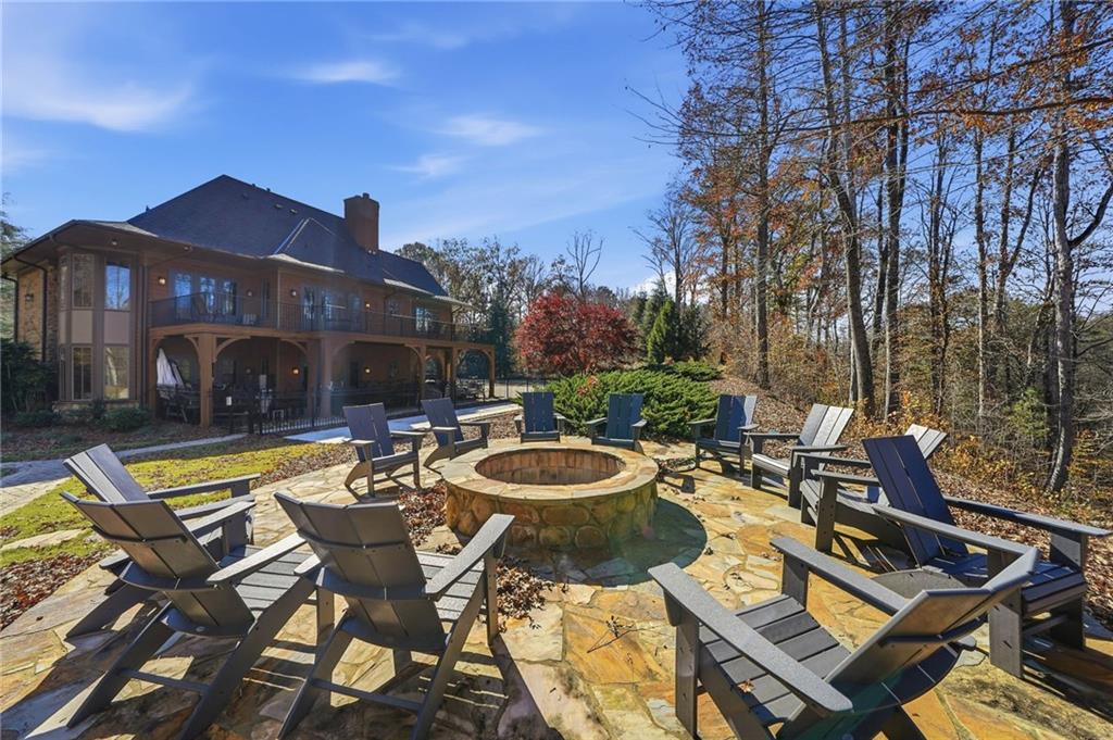 8840 Hightower Ridge Ball Ground, GA 30107 - Photo 59 of 74 a view of a patio with swimming pool table and chairs