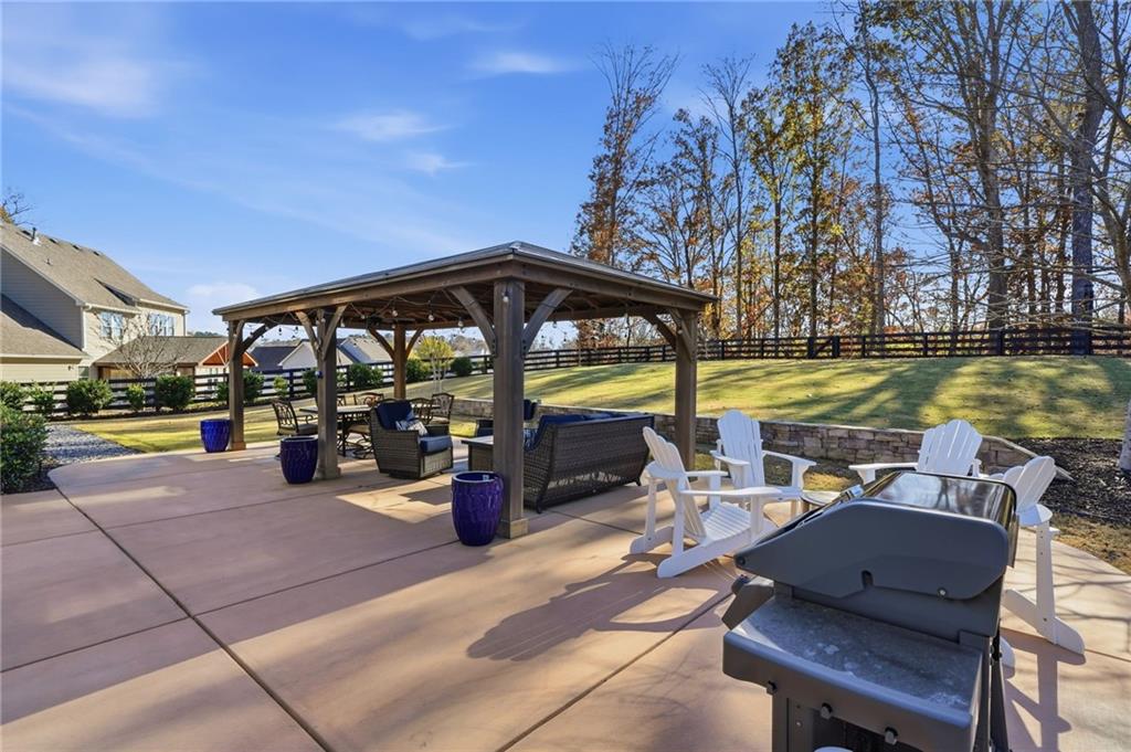 8840 Hightower Ridge Ball Ground, GA 30107 - Photo 60 of 74 a view of a swimming pool with outdoor seating