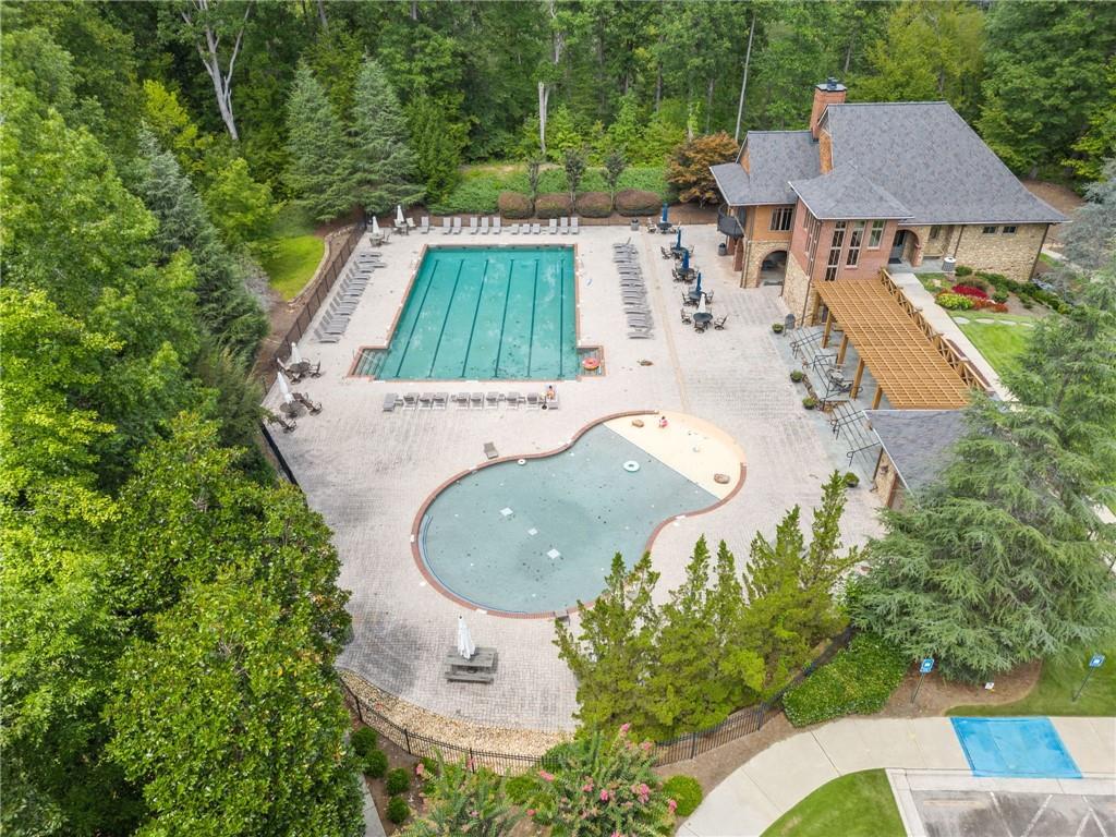 8840 Hightower Ridge Ball Ground, GA 30107 - Photo 67 of 74 an aerial view of a house with outdoor space and trees all around
