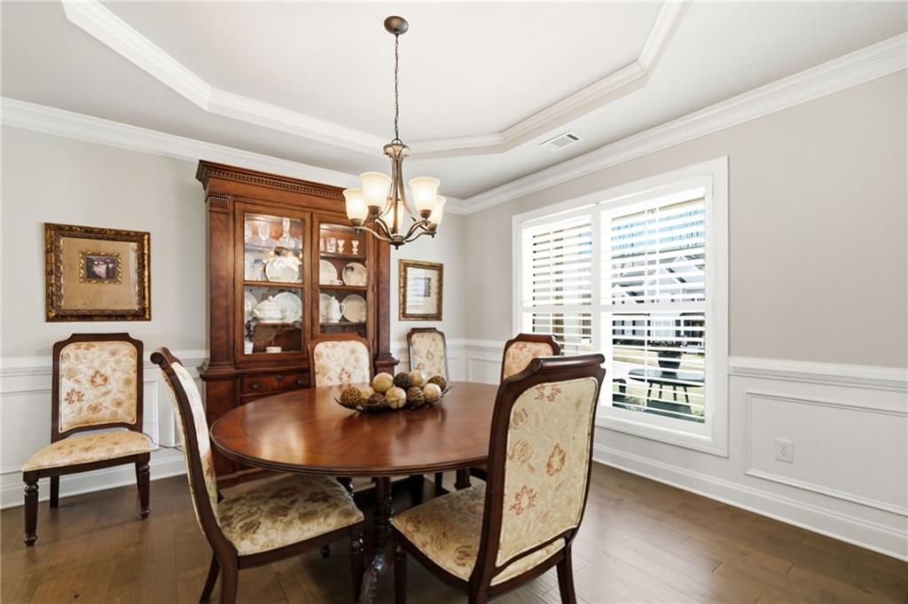 8840 Hightower Ridge Ball Ground, GA 30107 - Photo 9 of 74 a view of a dining room with furniture window and wooden floor