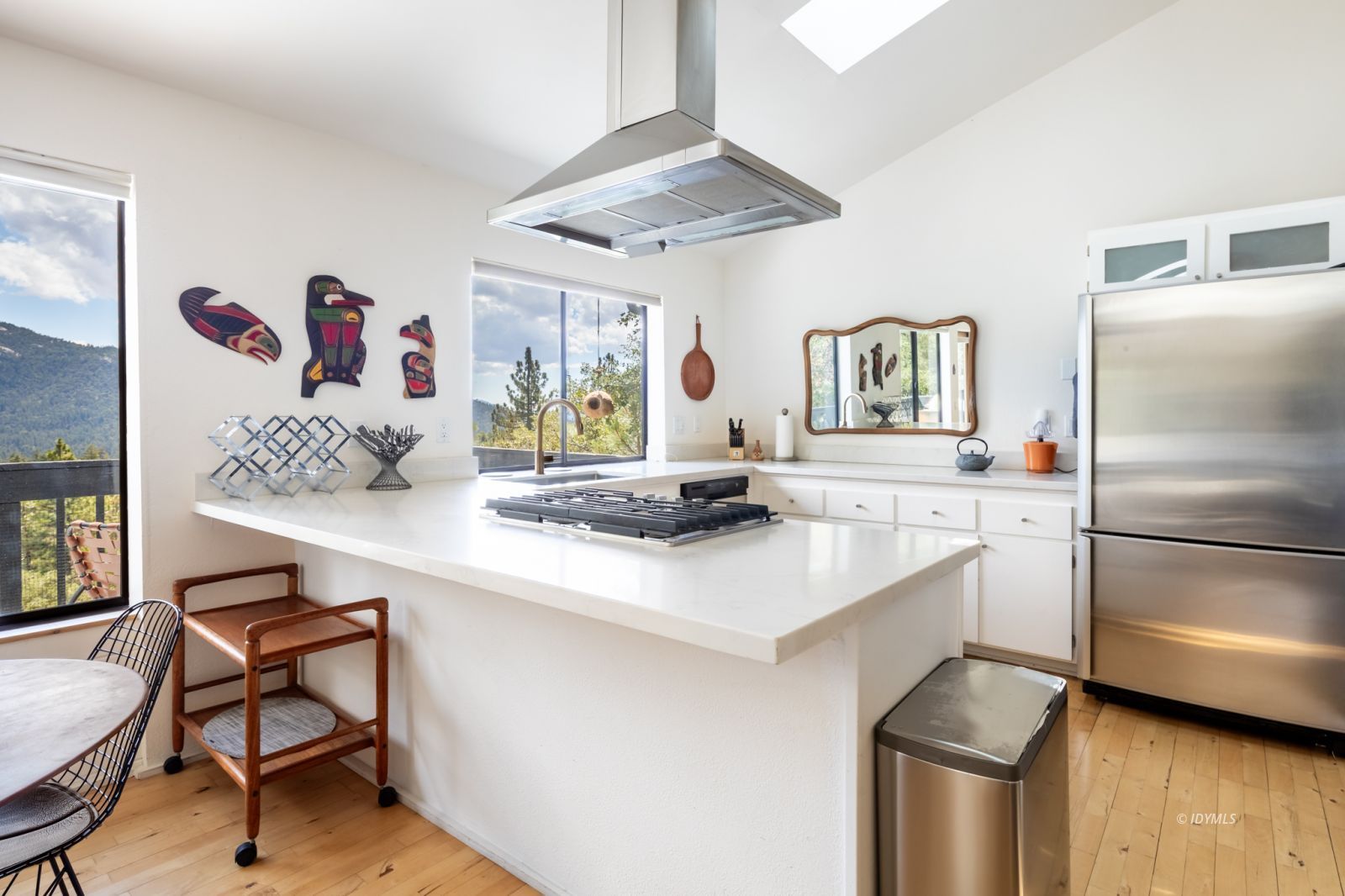 23916 Highway 243 Idyllwild, CA 92549 - Photo 16 of 47 a kitchen with stainless steel appliances granite countertop a sink and a refrigerator