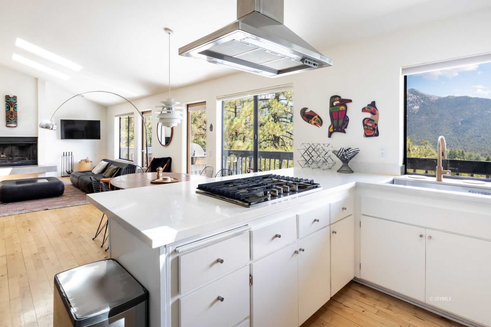 23916 Highway 243 Idyllwild, CA 92549 - Photo 18 of 47 a kitchen with a stove a sink and a refrigerator