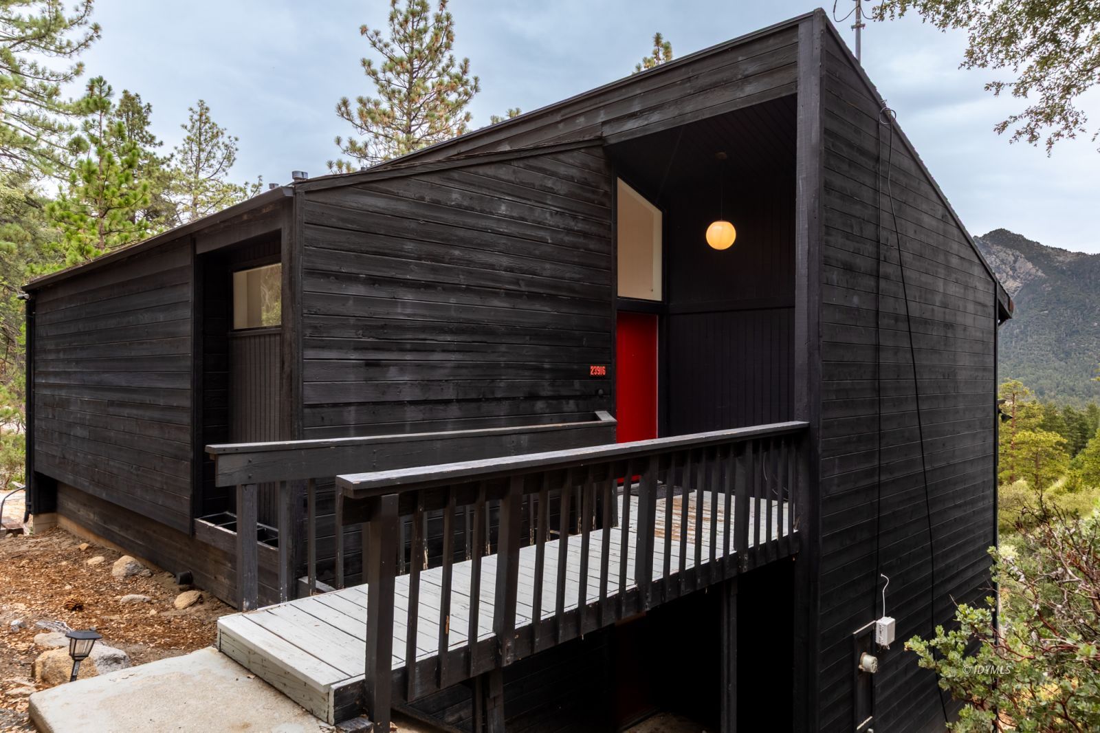 23916 Highway 243 Idyllwild, CA 92549 - Photo 2 of 47 a front view of a house with a yard