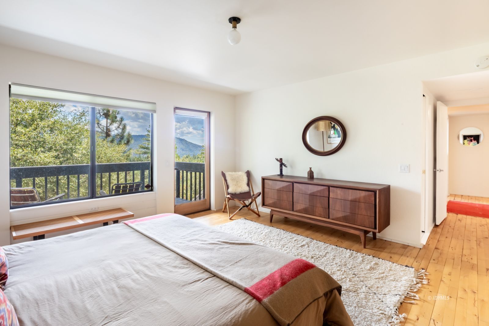 23916 Highway 243 Idyllwild, CA 92549 - Photo 23 of 47 a living room with a bed furniture and a large window