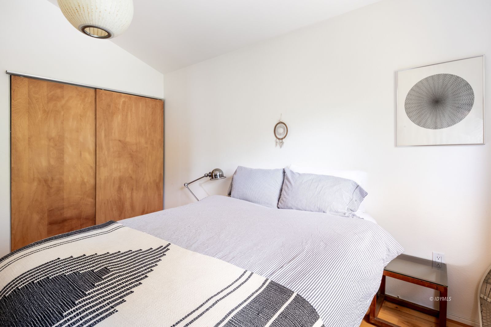 23916 Highway 243 Idyllwild, CA 92549 - Photo 33 of 47 a bedroom with a bed and a chair