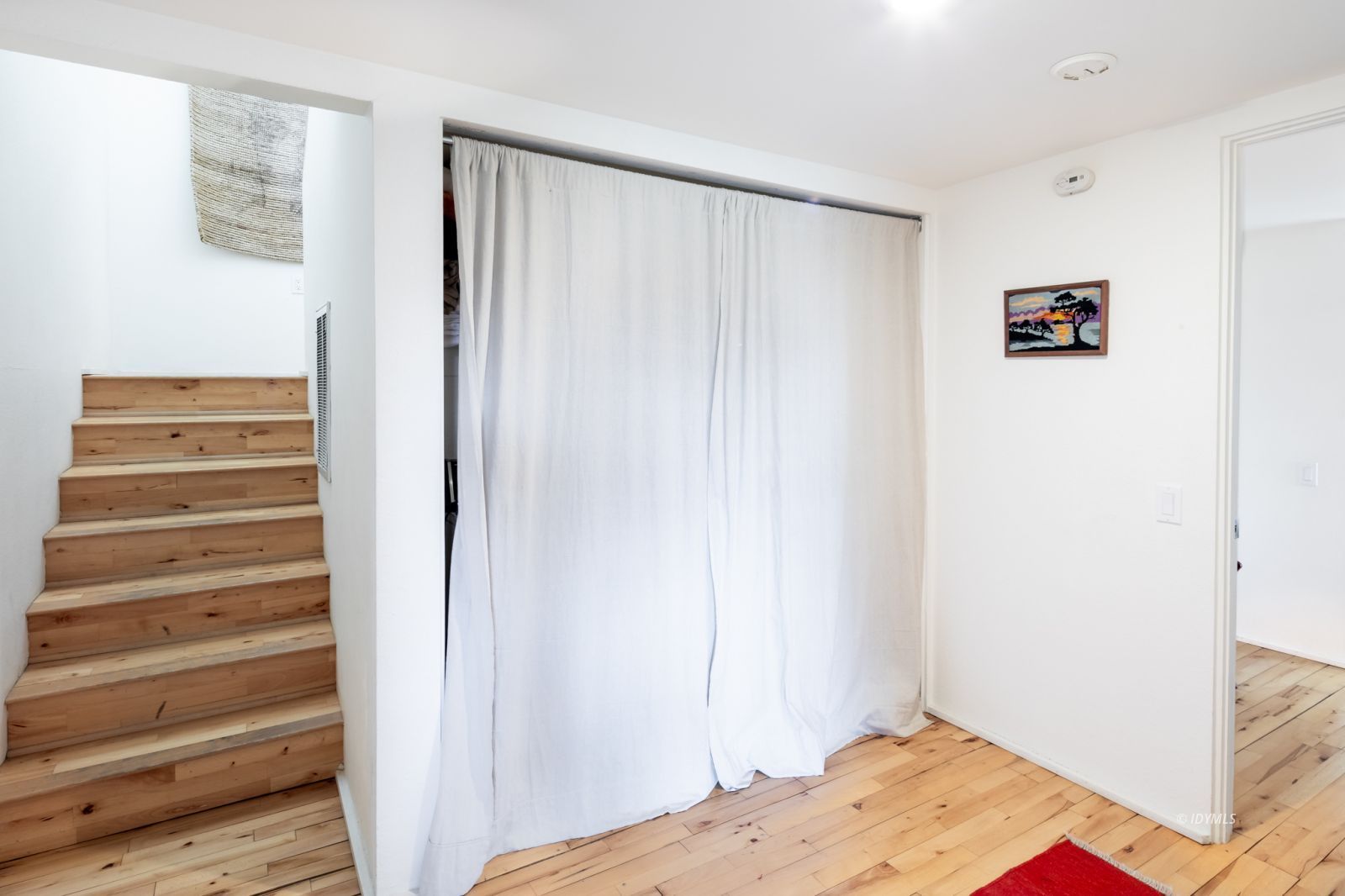 23916 Highway 243 Idyllwild, CA 92549 - Photo 41 of 47 a view of a bedroom with wooden floor and closet