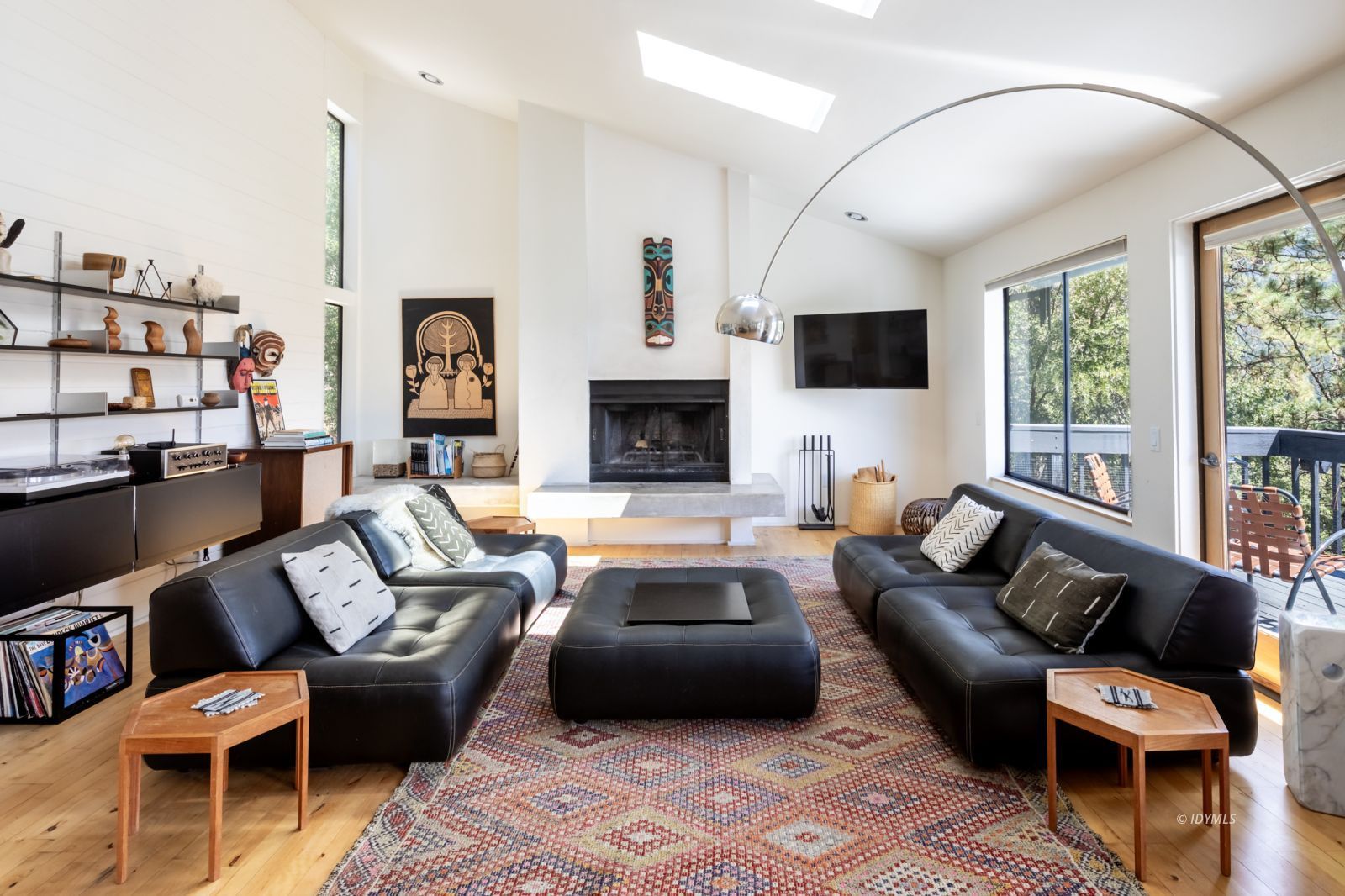 23916 Highway 243 Idyllwild, CA 92549 - Photo 8 of 47 a living room with furniture a fireplace and a flat screen tv