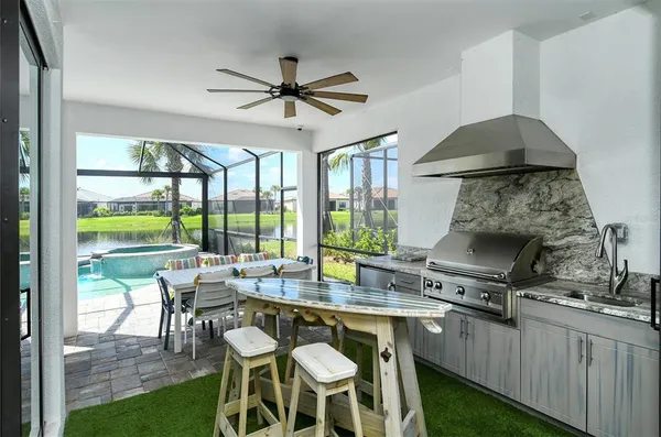 a dining room with a table chairs and a floor to ceiling window