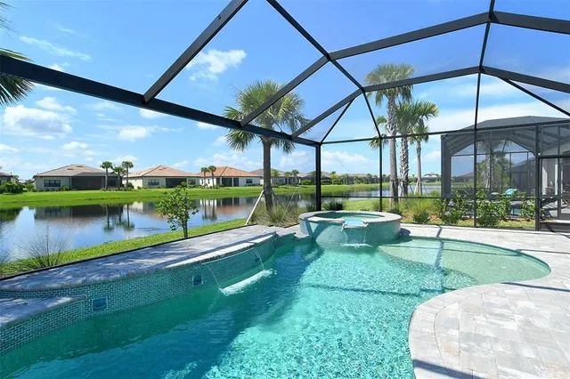 a swimming pool with outdoor seating and yard