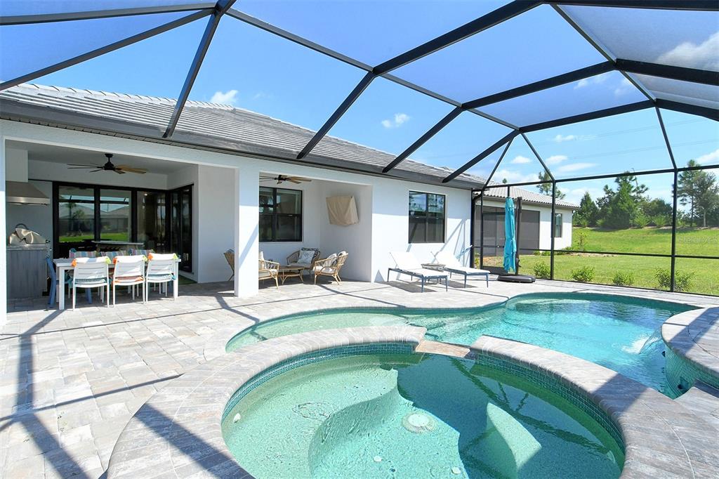 18114 Waterville Place Bradenton, FL 34202 - Photo 19 of 57 a view of a swimming pool with a patio