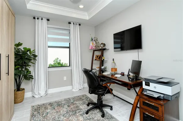 a bedroom with two beds and painted walls