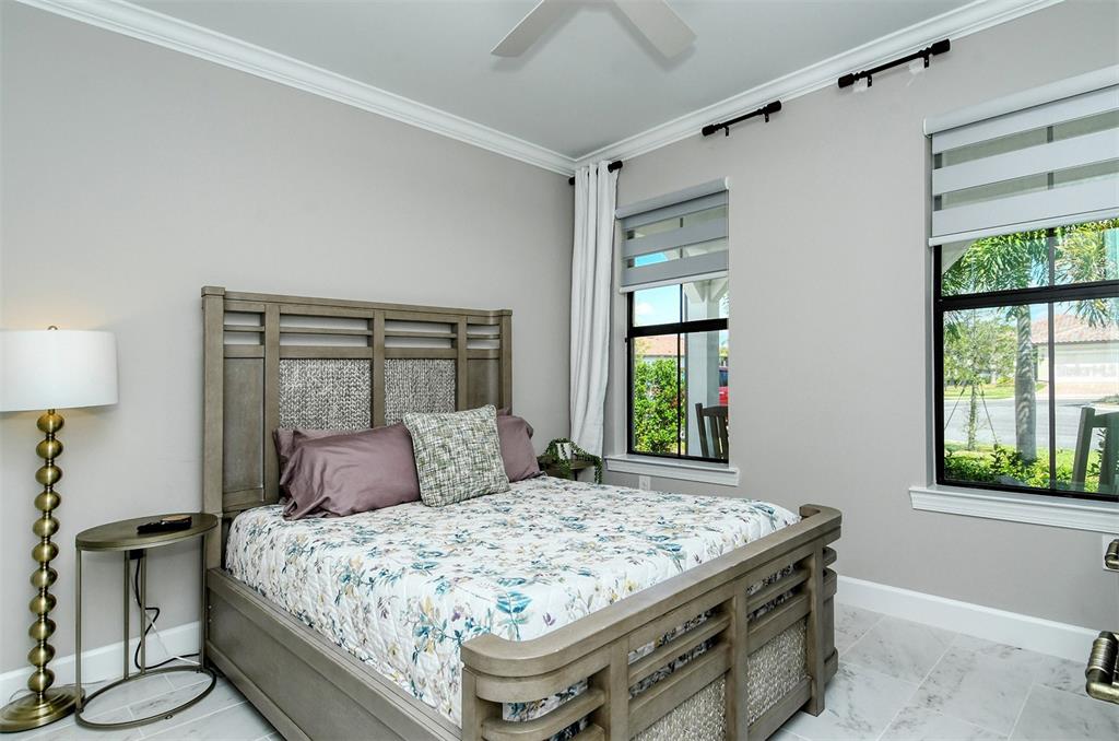 18114 Waterville Place Bradenton, FL 34202 - Photo 39 of 57 a bedroom with a bed and window