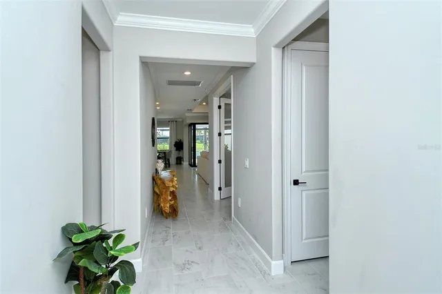 a view of a hallway with dining room and stairs