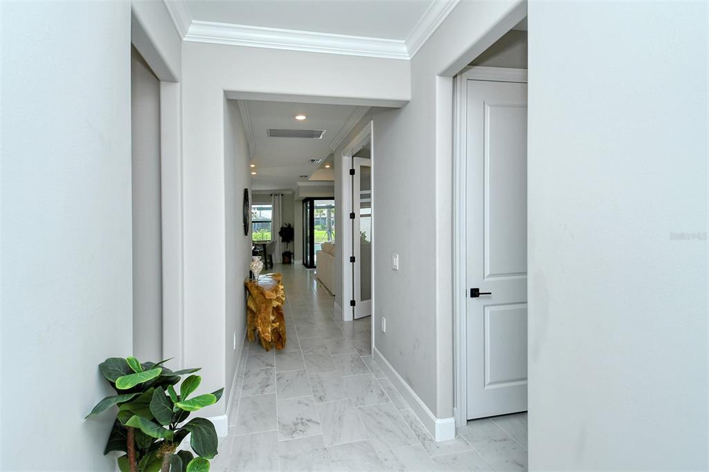 18114 Waterville Place Bradenton, FL 34202 - Photo 4 of 57 a view of a hallway with dining room and stairs