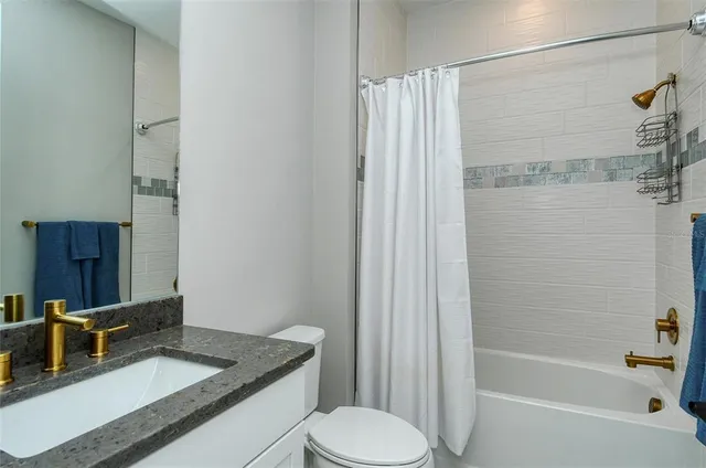 an outdoor sitting area with a table and chairs