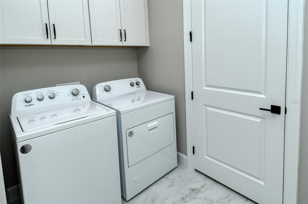 18114 Waterville Place Bradenton, FL 34202 - Photo 44 of 57 a utility room with dryer and washer