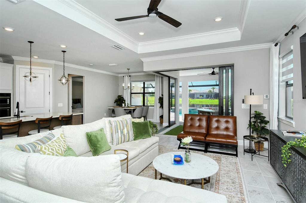 18114 Waterville Place Bradenton, FL 34202 - Photo 7 of 57 a living room with furniture and a large window
