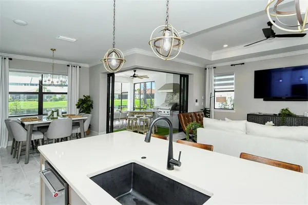 a view of a kitchen and dining room