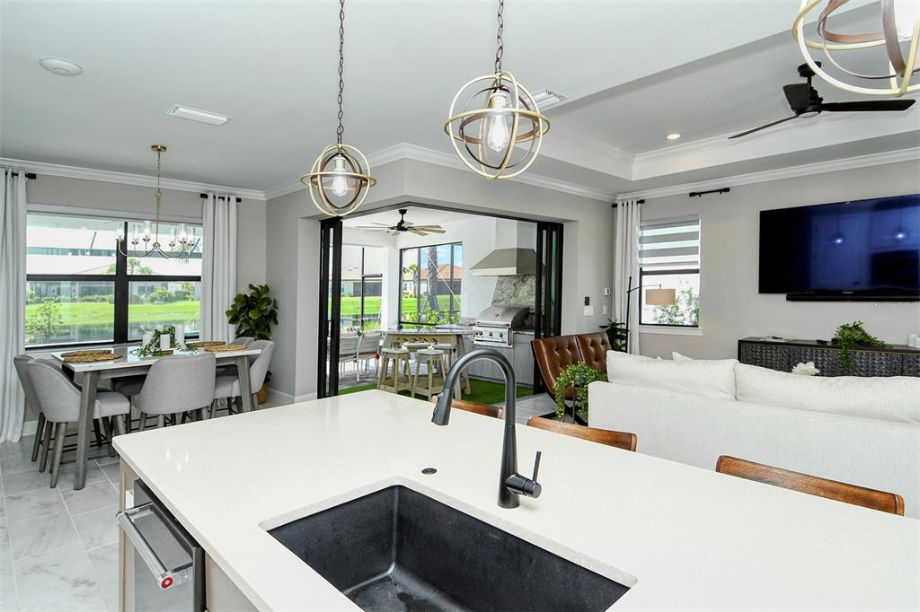 18114 Waterville Place Bradenton, FL 34202 - Photo 9 of 57 a view of a kitchen and dining room