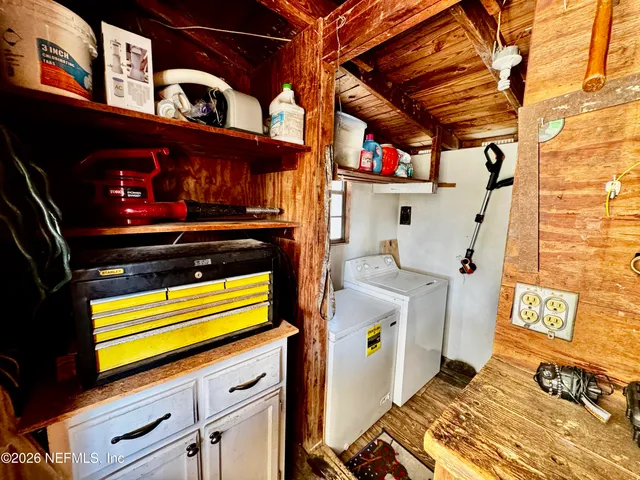 a view of balcony with two chairs and a flat screen tv