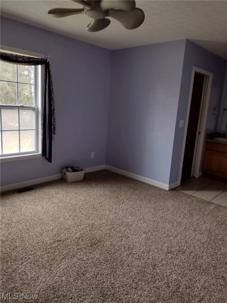 3270 Ridge Road Zanesville, OH 43701 - Photo 13 of 17 Third bedroom with ceiling fan and light carpet