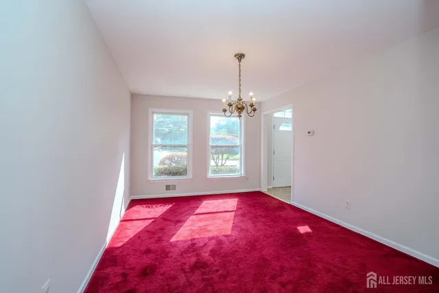 a bathroom with a toilet a sink and a window