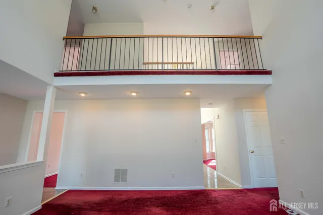 a kitchen with stainless steel appliances granite countertop a refrigerator and a stove
