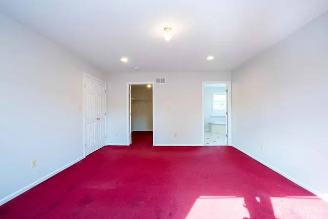 an aerial view of a house with a garden lake view