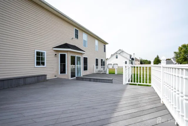 a view of deck with a large trees