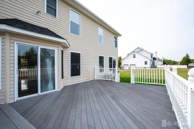 a view of a field with trees in the background