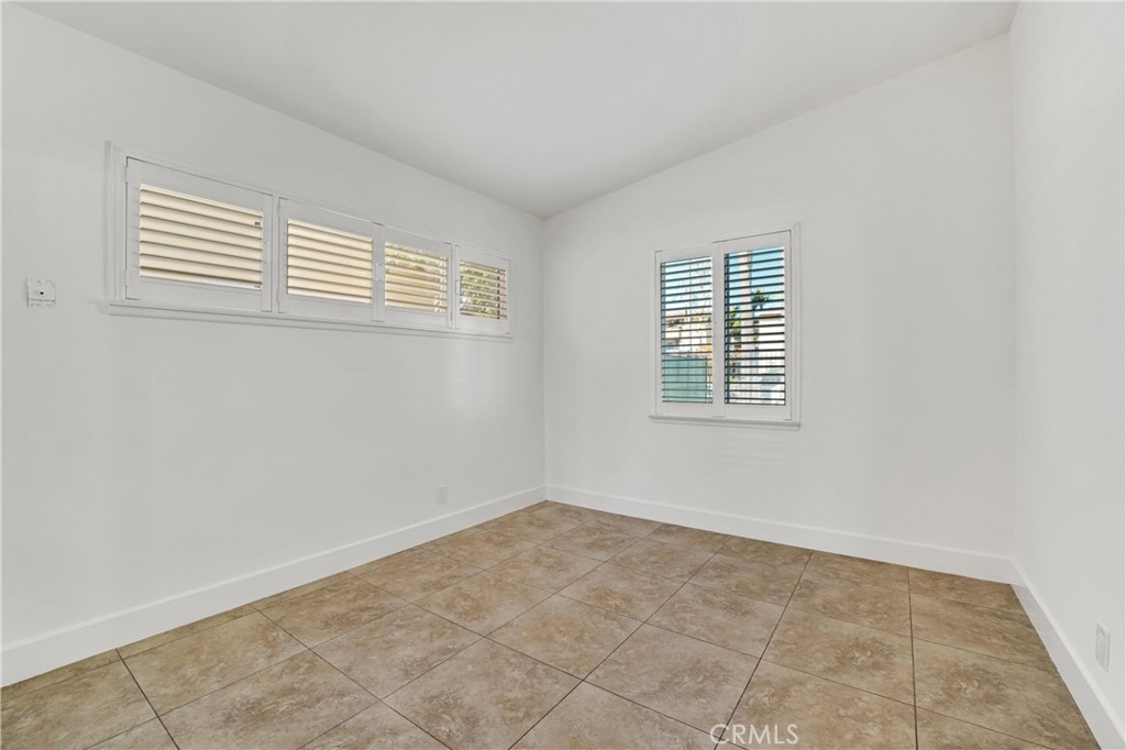 20300 Sherman Way Winnetka, CA 91306 - Photo 17 of 33 a view of an empty room with a window