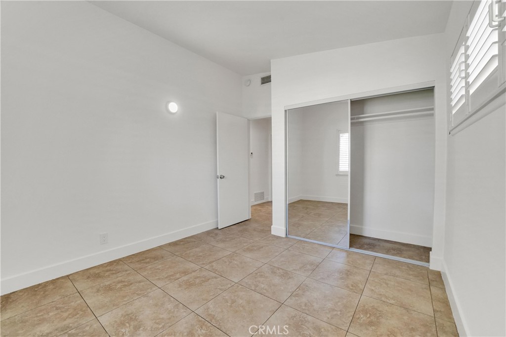 20300 Sherman Way Winnetka, CA 91306 - Photo 18 of 33 an empty room with a natural light