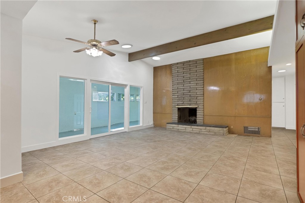 20300 Sherman Way Winnetka, CA 91306 - Photo 5 of 33 a view of an empty room with a fireplace