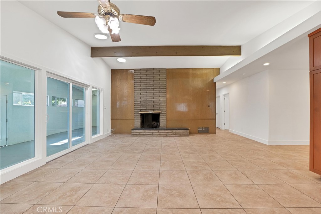 20300 Sherman Way Winnetka, CA 91306 - Photo 6 of 33 a view of an empty room with a fireplace