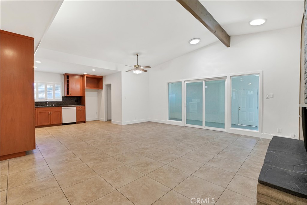 20300 Sherman Way Winnetka, CA 91306 - Photo 7 of 33 a view of an empty room with kitchen and a window