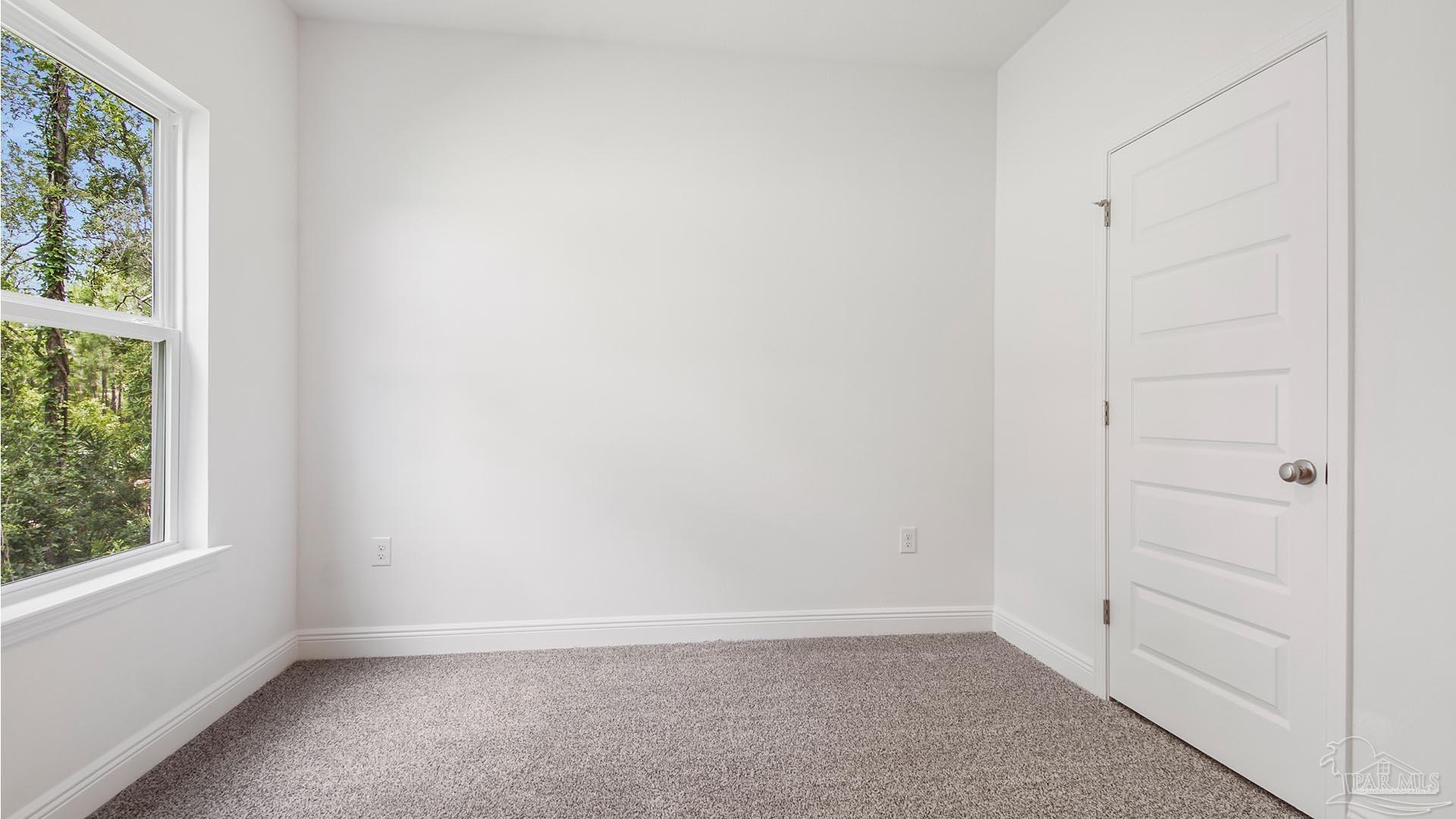 3233 Harrier Road Pace, FL 32571 - Photo 29 of 50 an empty room with a window