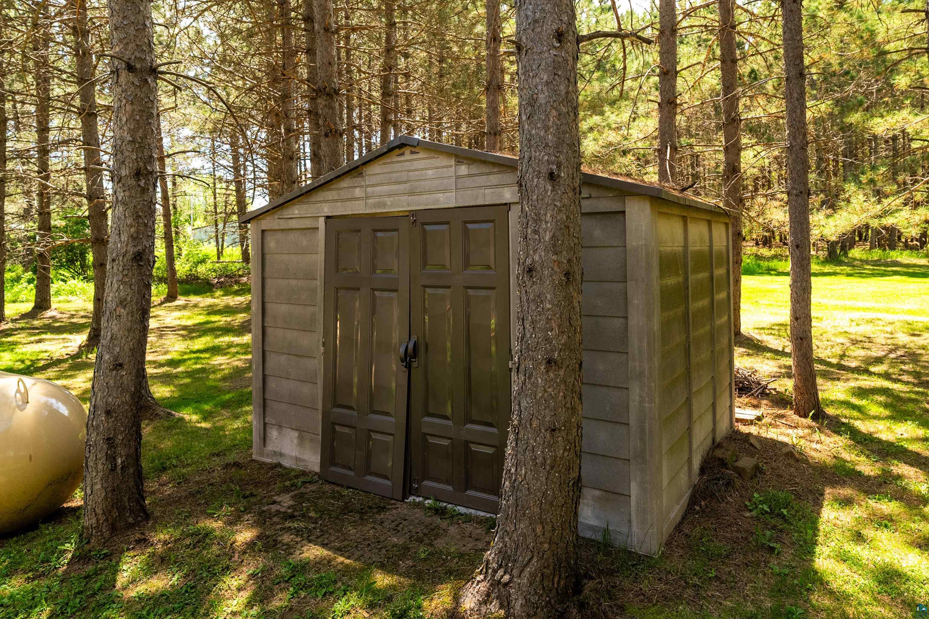 75 East Stark Road Esko, MN 55733 - Photo 66 of 87 Garden shed with double doors, wood-finish siding, and a gabled roof