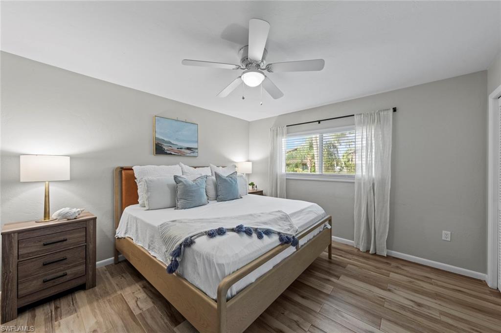 843 Palm View Drive, Unit 25 Naples, FL 34110 - Photo 11 of 27 a bedroom with a bed and a window